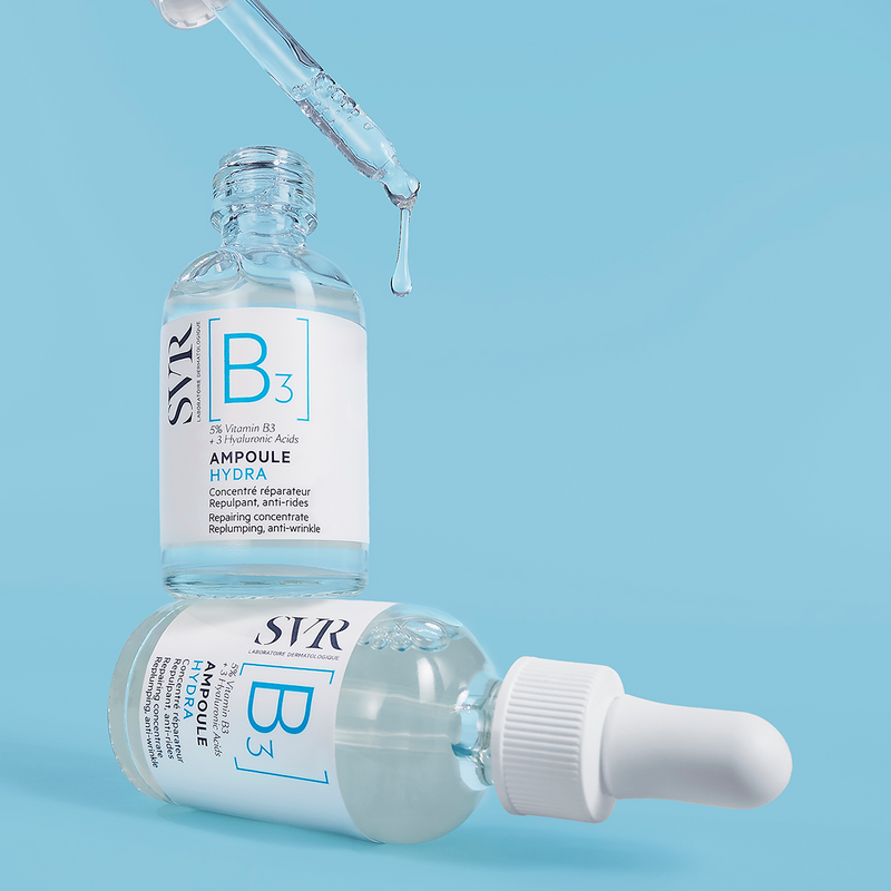 SVR Ampoule B3 Hydra serum bottles with glass dropper on a light blue background.