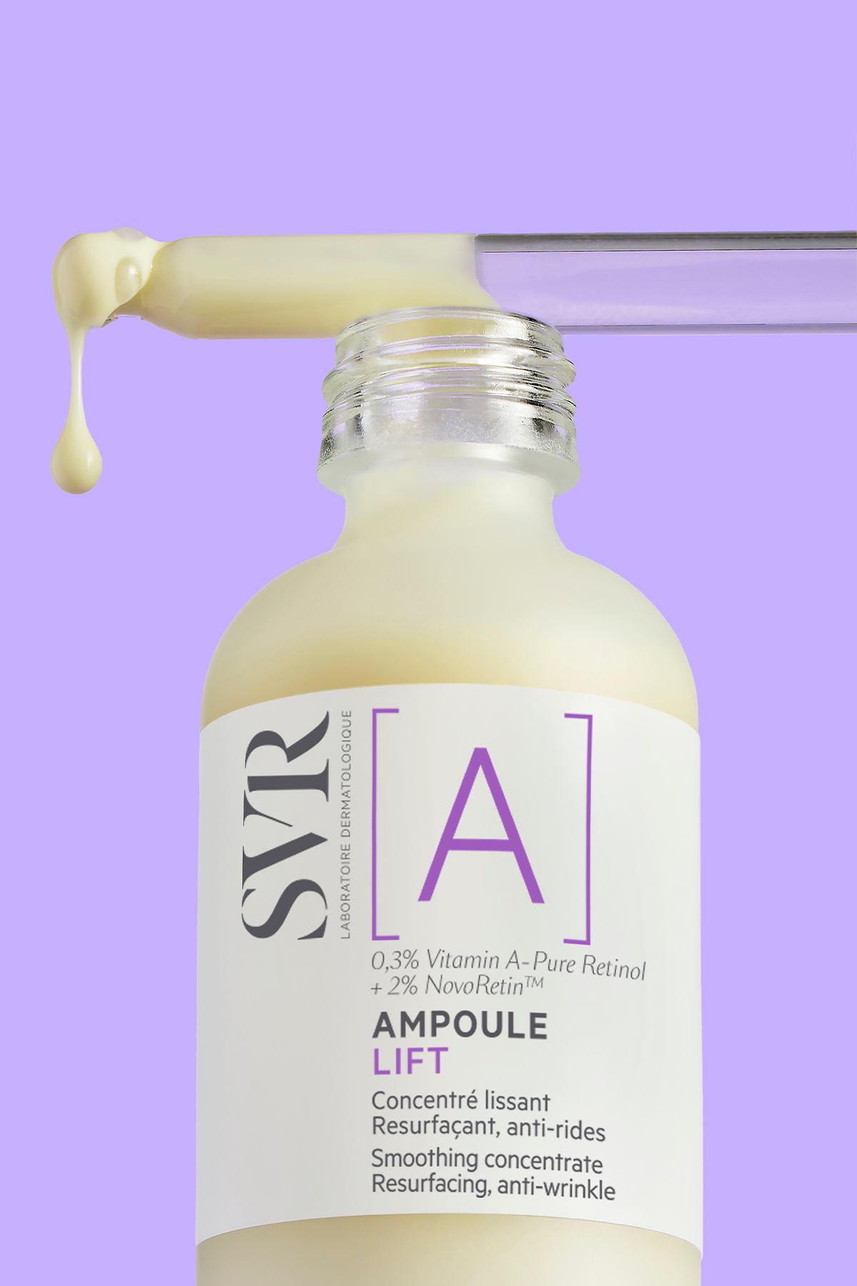 SVR Ampoule A anti-wrinkle serum bottle with a glass dropper dispensing a creamy yellow drop against a purple background.
