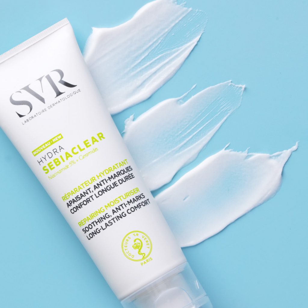 SVR Sebiaclear Hydra facial cream tube with white moisturizer swatches on blue background.