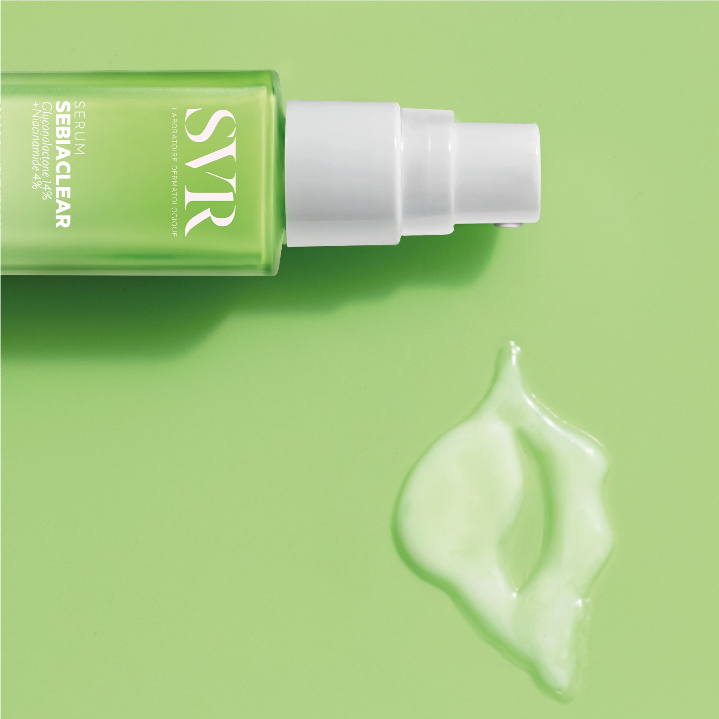SVR SEBIACLEAR serum bottle with a white pump dispenser and a drop of clear, fluid serum on a light green background.