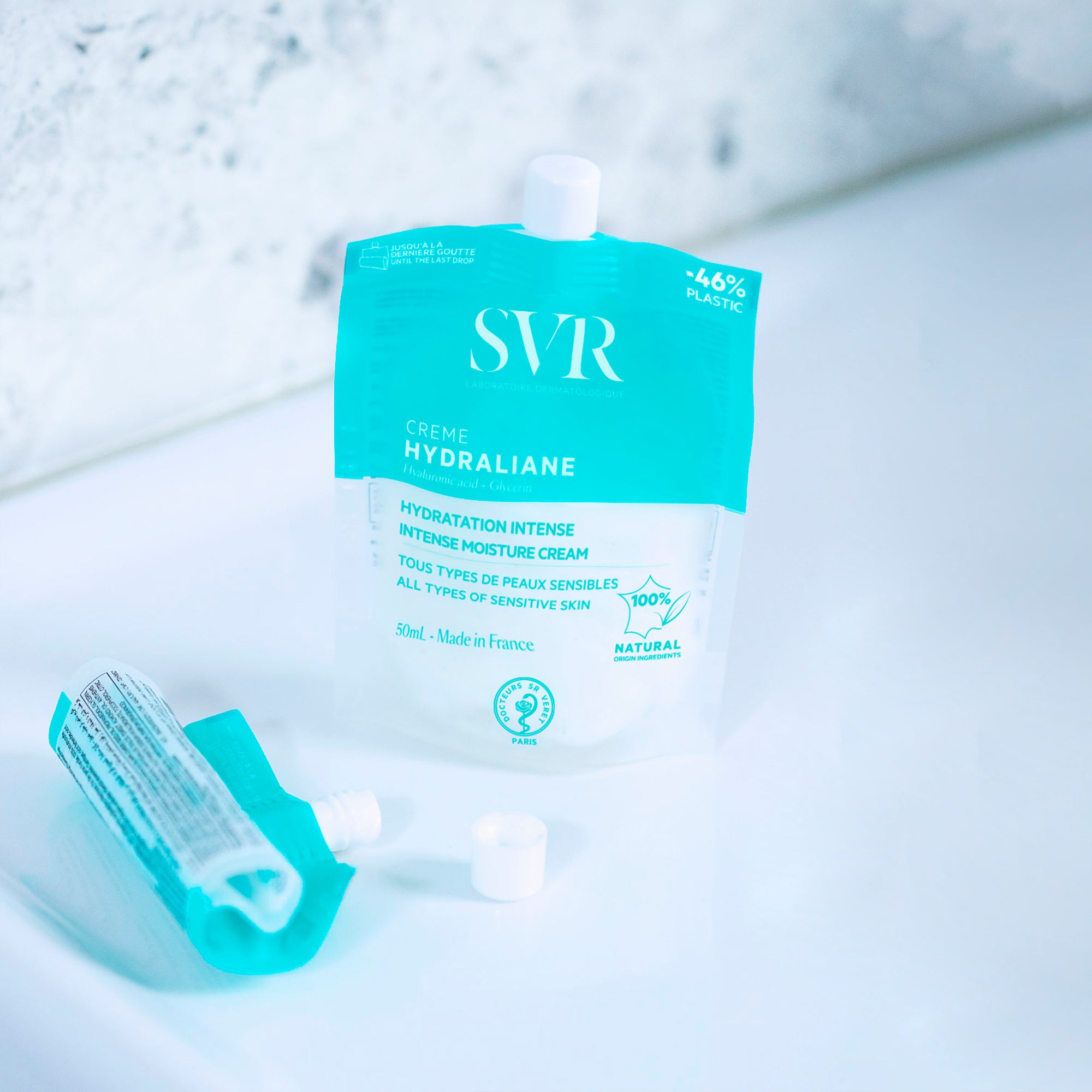 SVR Hydraliane light blue and white flexible pouch moisturizer with small white cap on minimalist white surface.