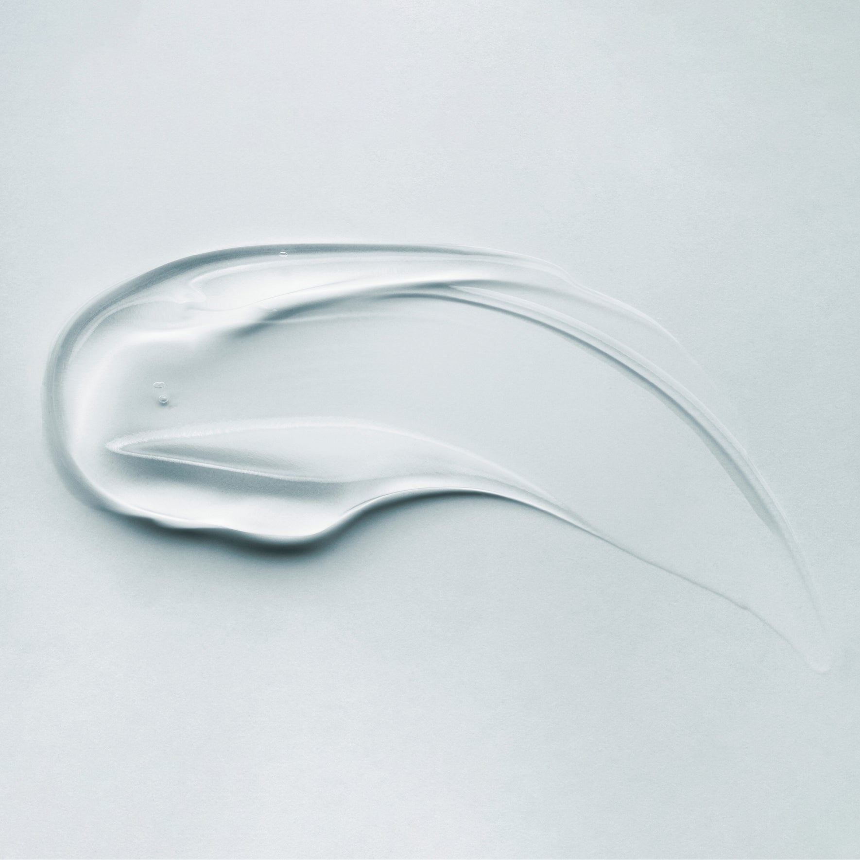Clear, smooth smear of SEBIACLEAR Foaming Gel showing a lightweight, translucent texture on a light background.
